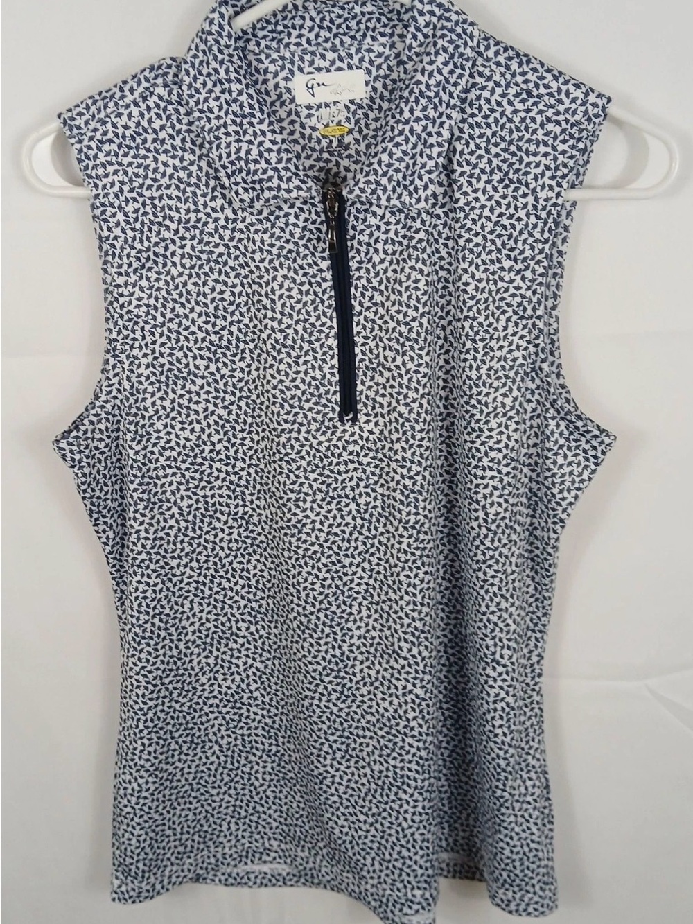 Greg Norman Women’s Golf Collection. Navy and White Quarter-Zip Top